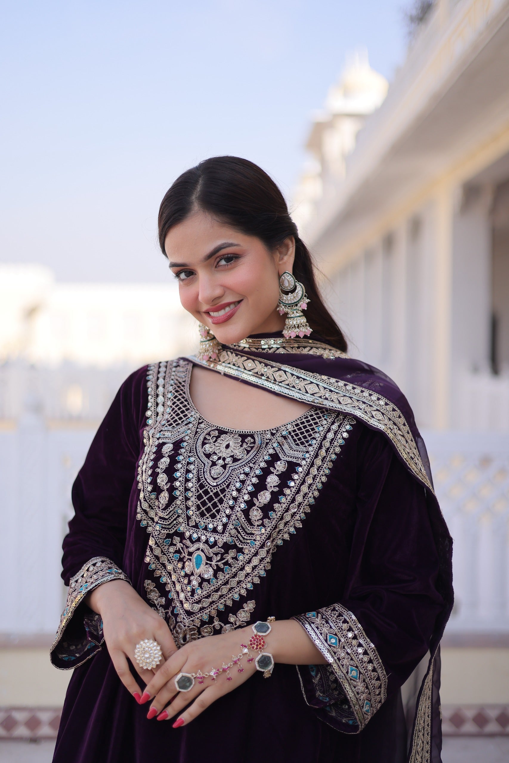 Festive wine color velvet suit with zari and mirror work