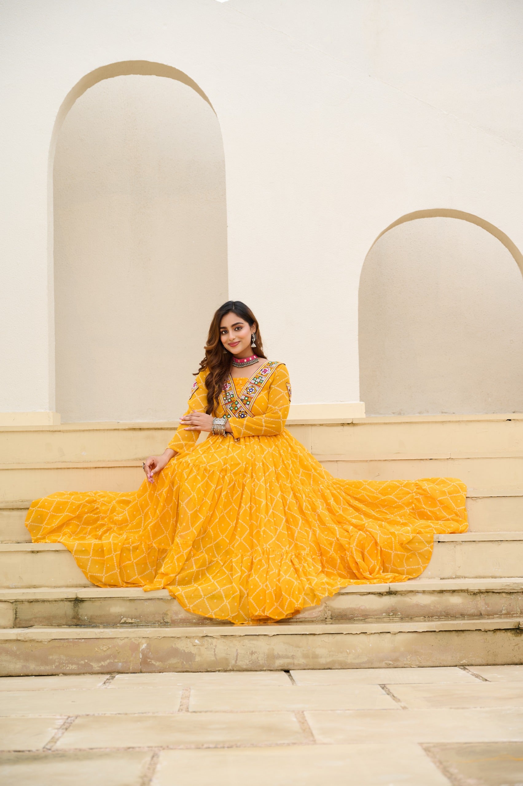 YELLOW faux georgette bandhani gown for festive wear
